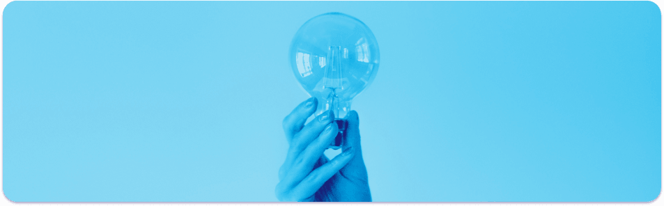 hand holding blue lightbulb