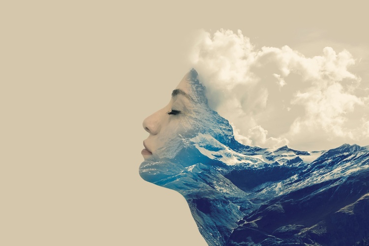 woman fading into mountains