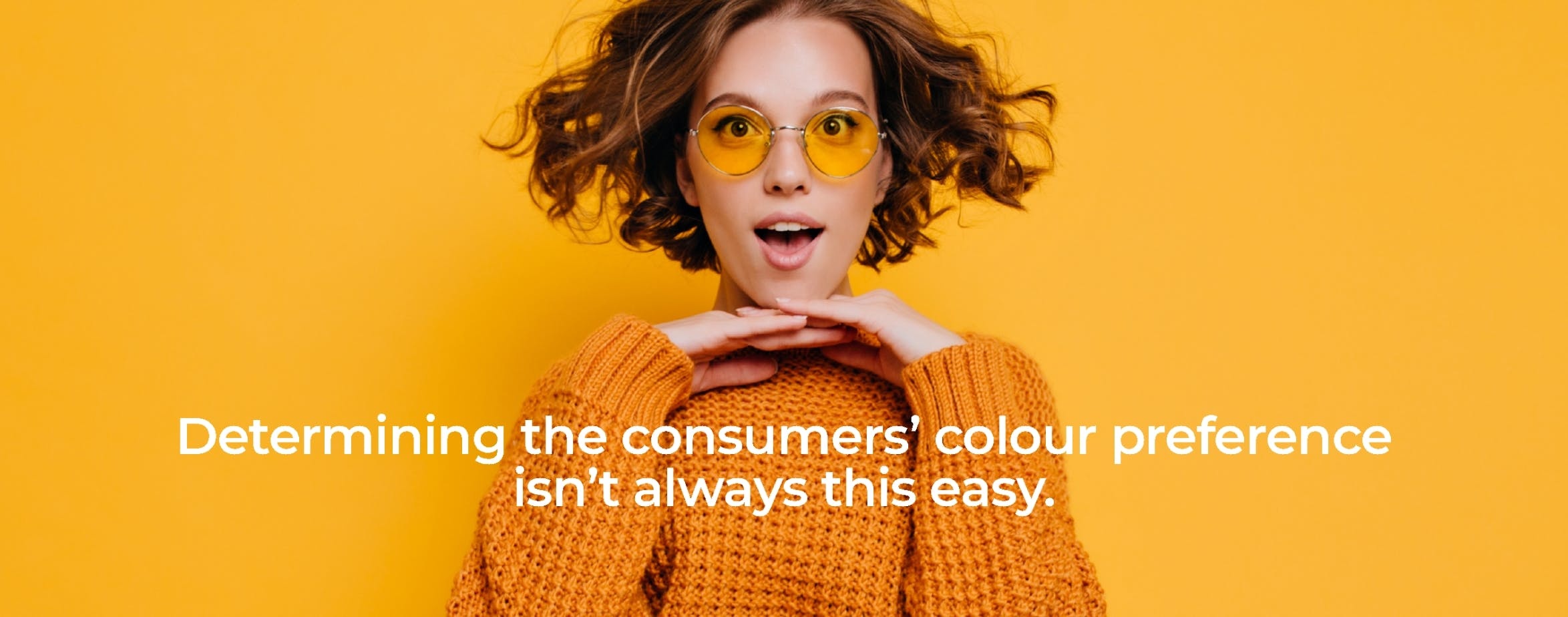 woman with orange glasses and sweater on an orange background